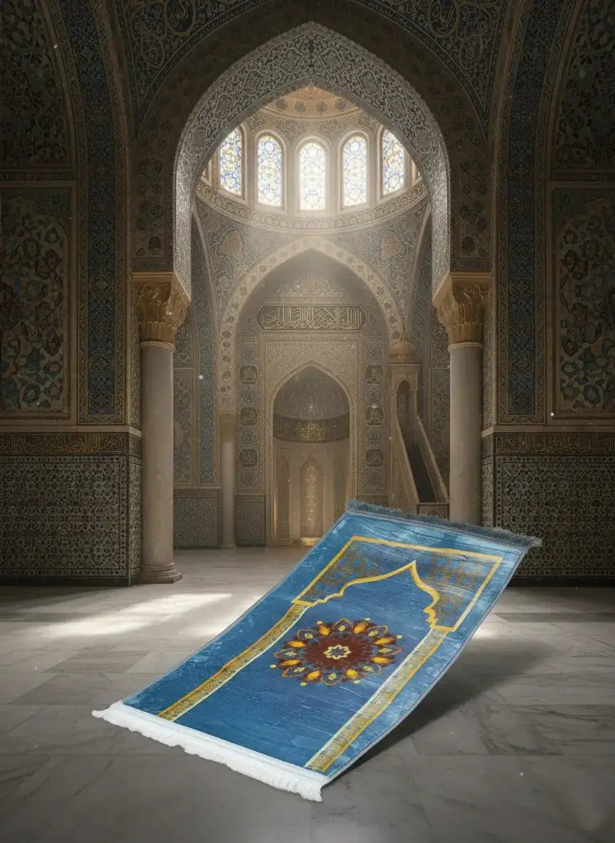 Blue prayer rug with intricate design on a stone floor in a mosque.